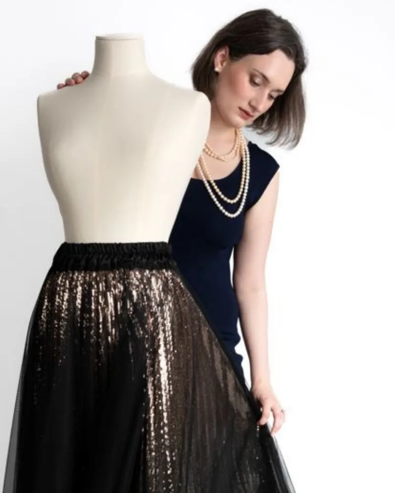 Anna Matteucci with a dress form and a sequinned tulle skirt, styling session in Bologna